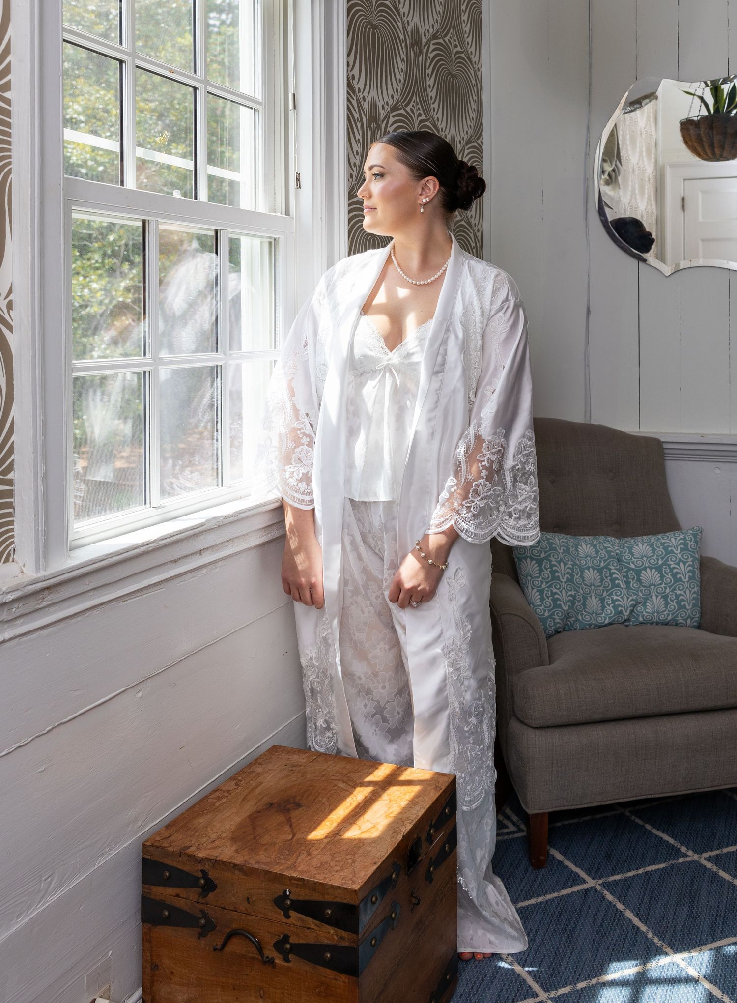 Photo of bride looking out a window. Photo at The Historic Robertson Homestead by Rock Hill Photographer, Natalie Wilson