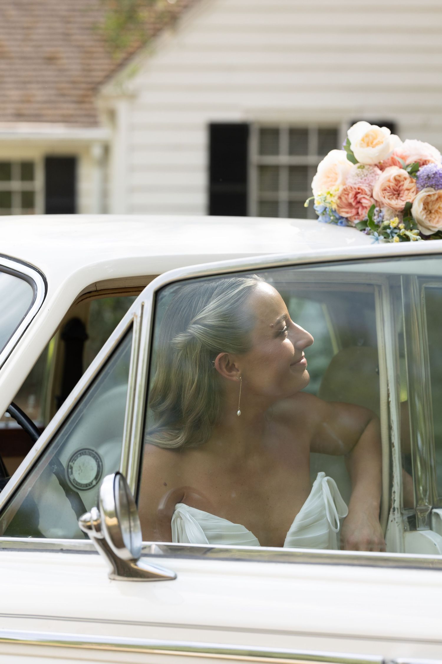 Photograph of a bride at her wedding in a vintage car at Cotton Hall in South Carolina taken by Rock Hill Wedding Photographer