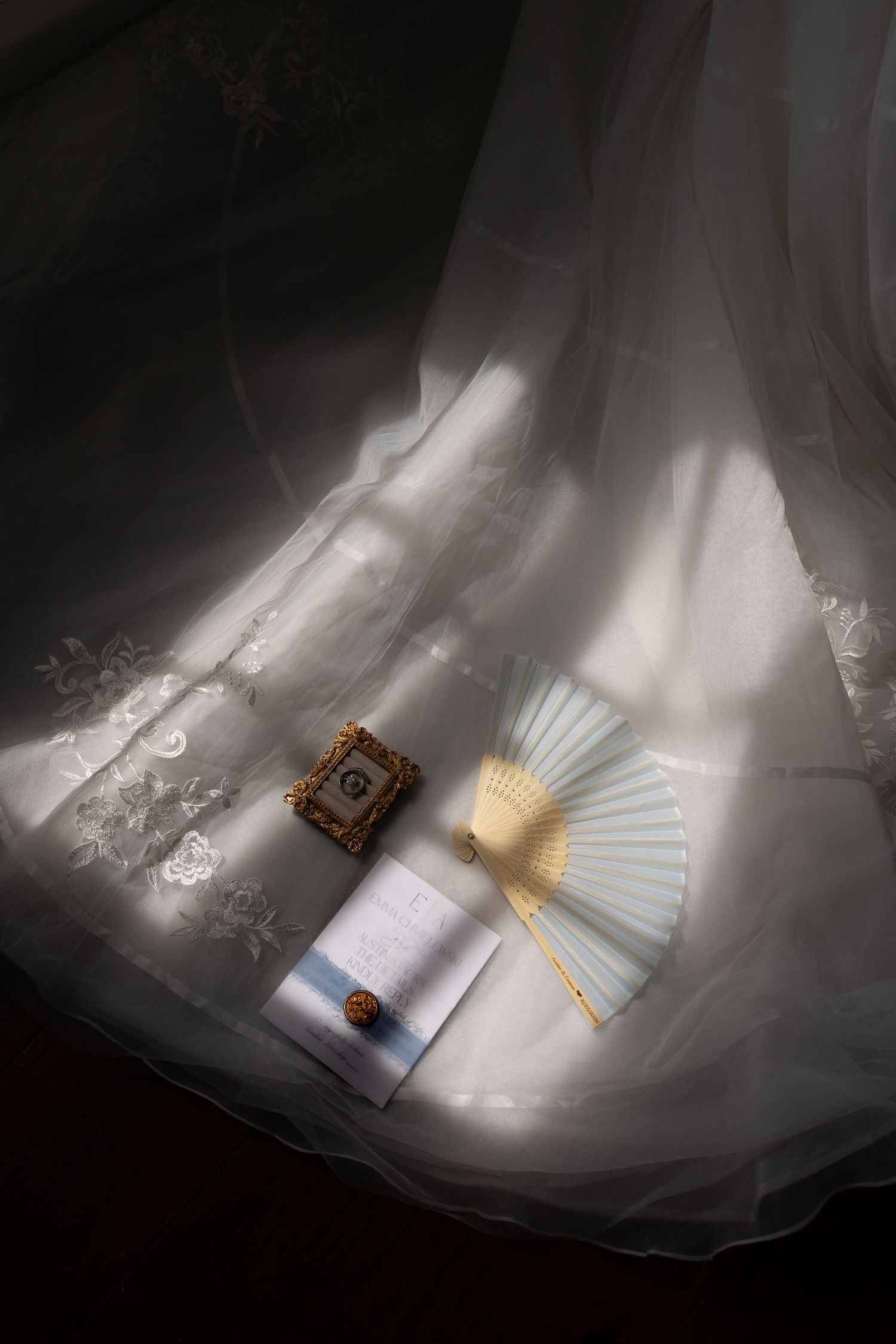 Wedding invitation and details on brides dress. Photo taken by Rock Hill Wedding Photographer, Natalie Wilson