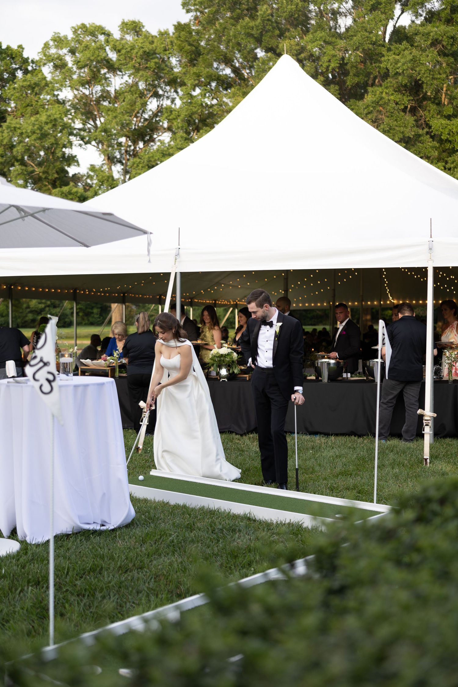 Bride and groom playing mini golf, photo by Rock Hill Wedding Photographer, Natalie Wilson Photo