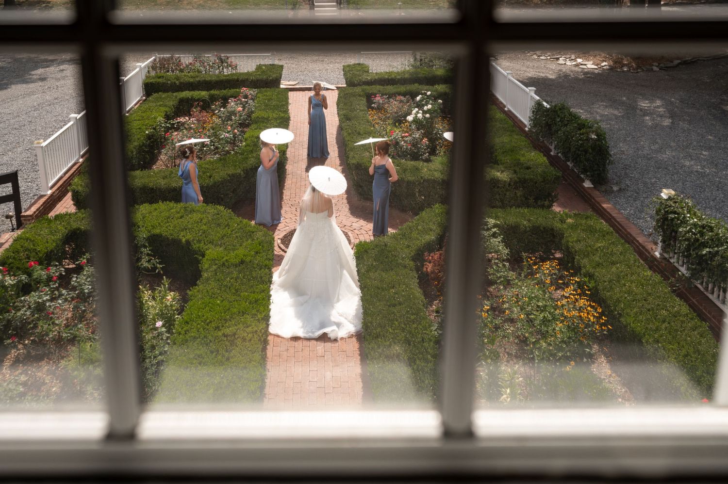 Bridesmaids with parasols. Photo at The Historic Robertson Homestead by Rock Hill Photographer, Natalie Wilson