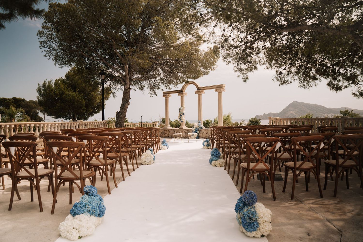 Beautiful outdoor wedding ceremony area at Marques de Montemolar overlooking the Mediterranean Sea and Altea Church, Costa Blanca, Spain