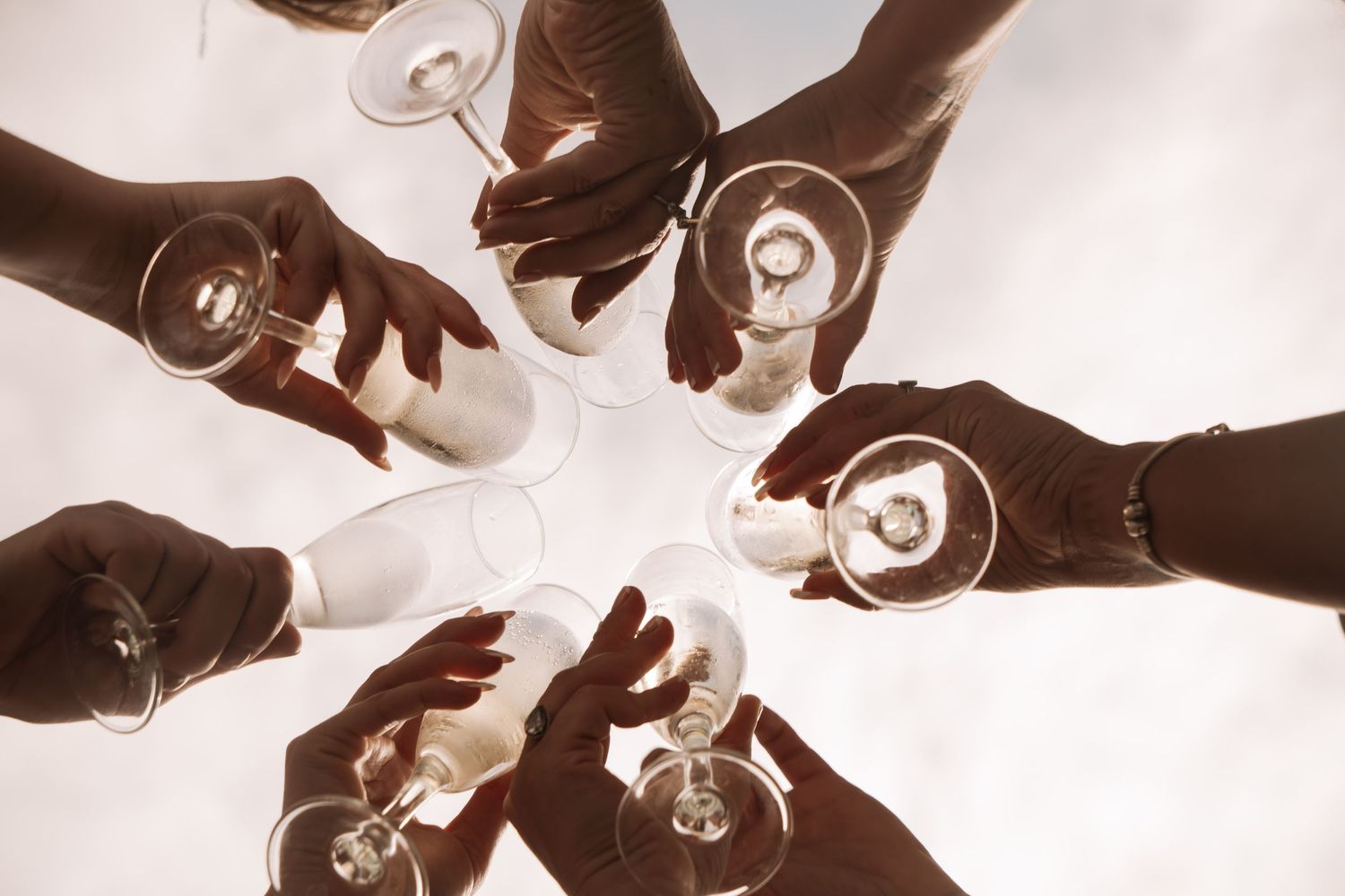 Bridal party raising glasses and celebrating at a destination wedding in Altea, Alicante, Spain