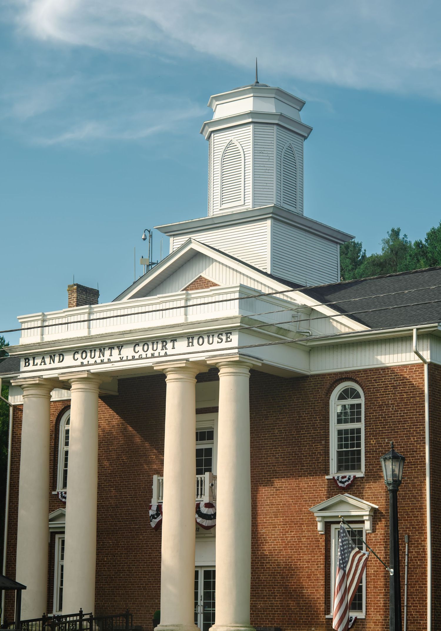Bland County Court House, a historic red brick building with white columns and cupola in Virginia.