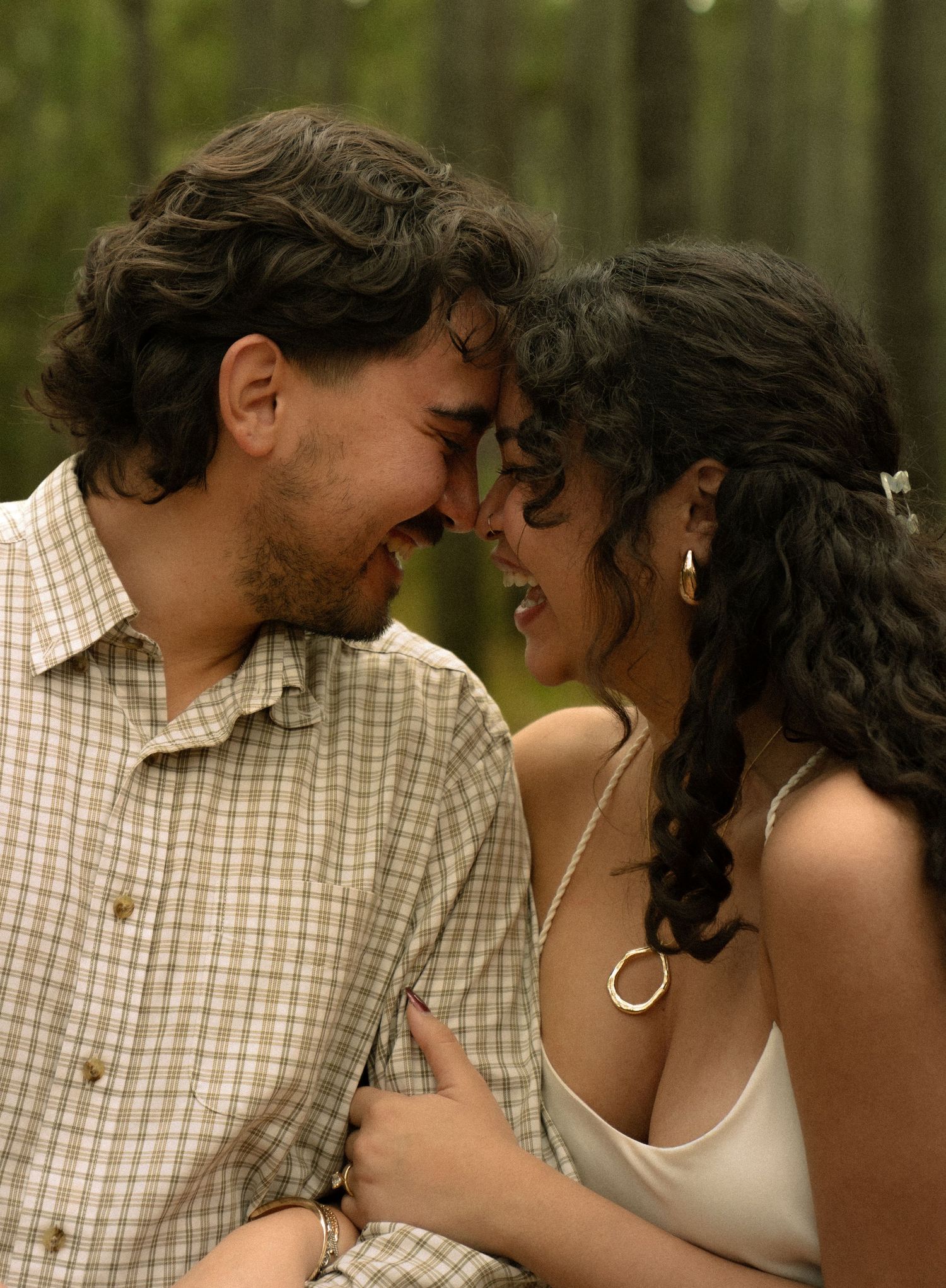 A romantic couple in casual attire sharing intimate moments across a series of connected photos.