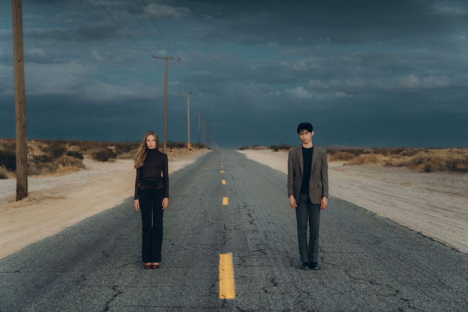 A collage of five photos showing people walking on empty desert roads under moody cloudy skies.