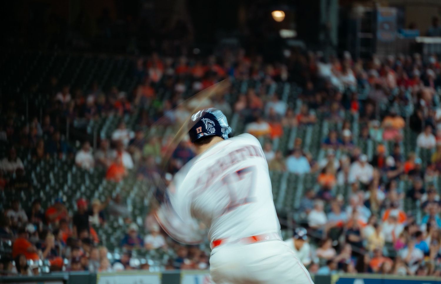 Baseball player winds up to throw a pitch at Camden Yards during a professional baseball game.