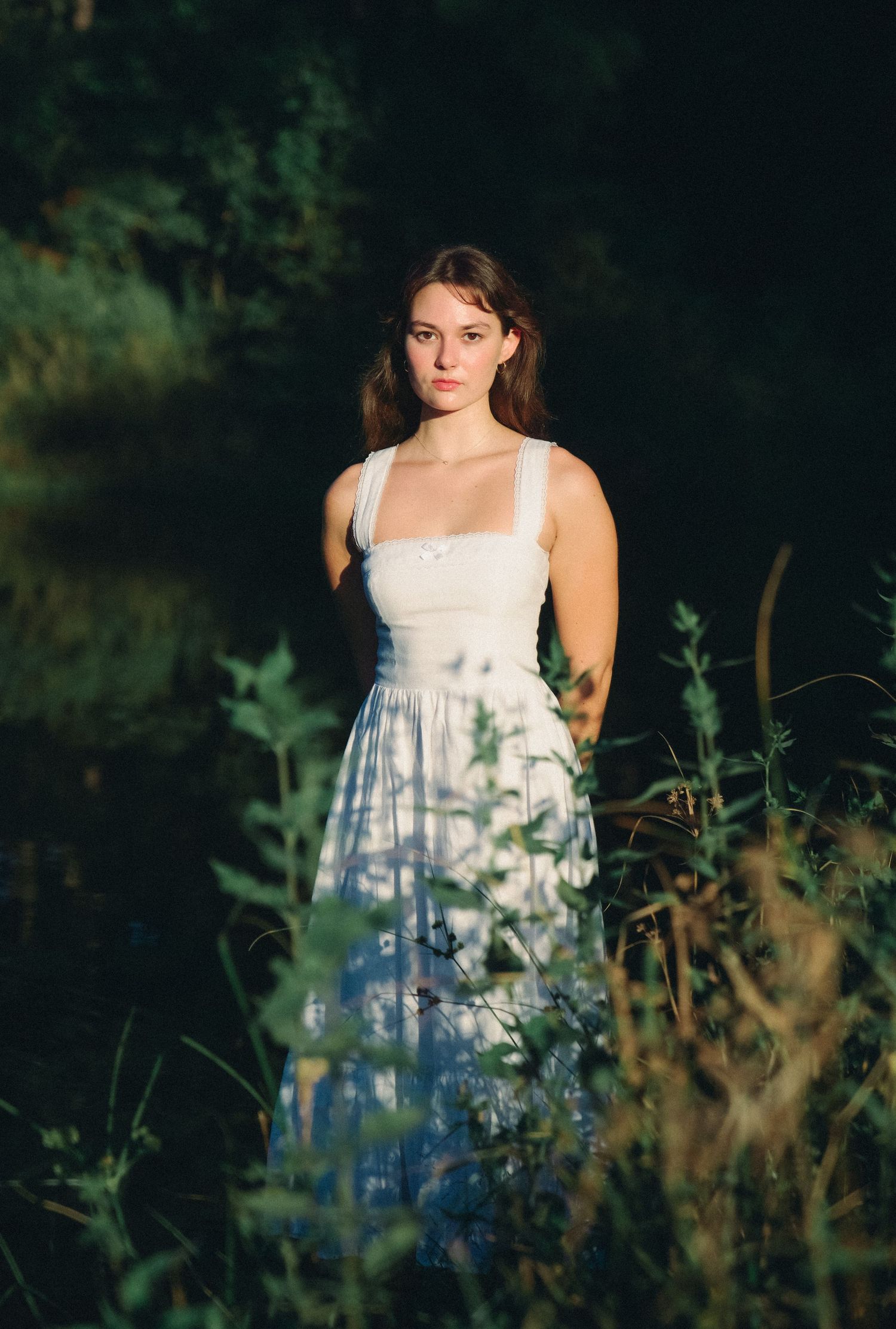 Summer portrait in a wildflower meadow with natural backlighting.
