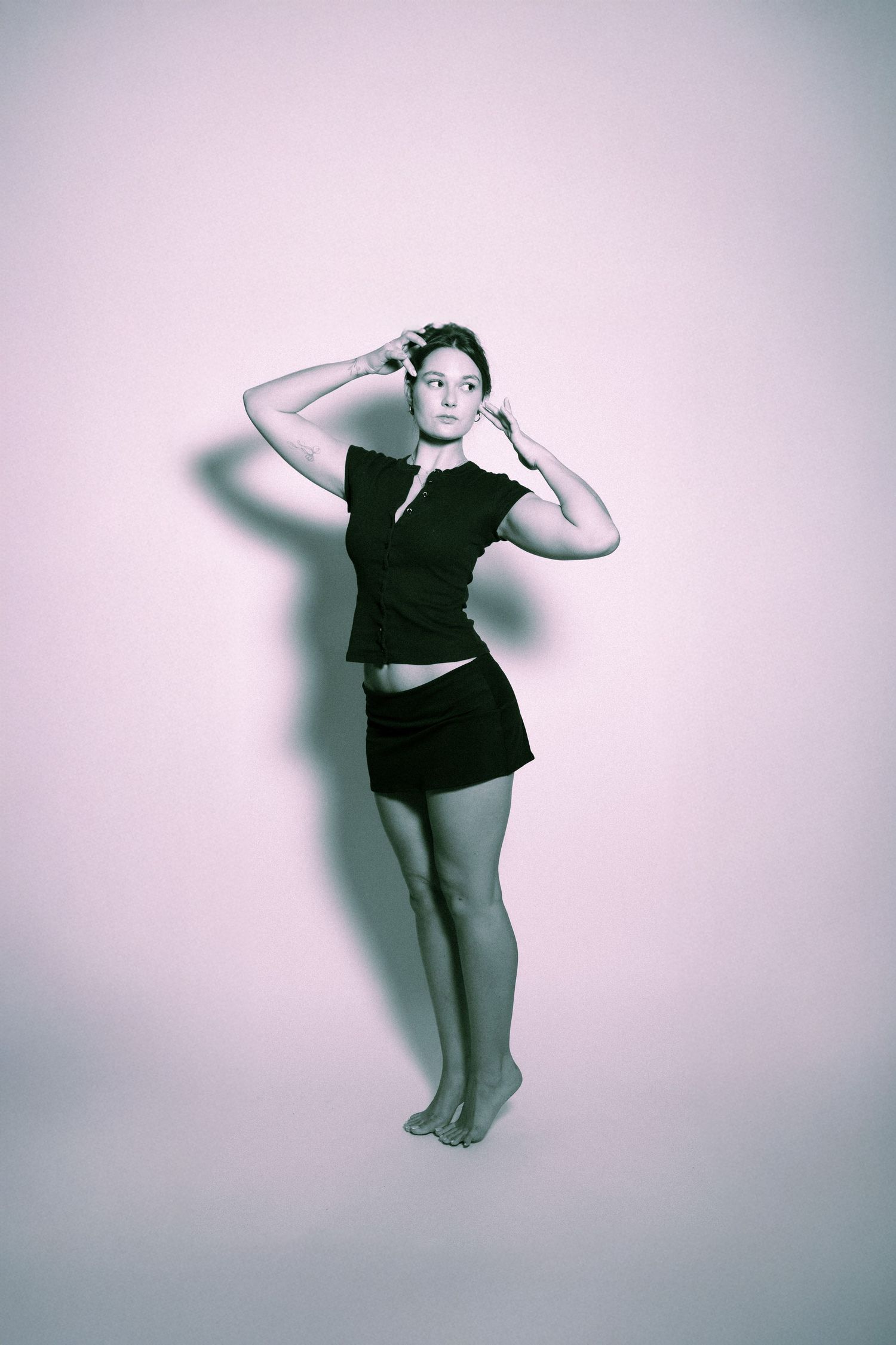 A series of four artistic dance poses on a light background showing expressive body movements in monochromatic style.