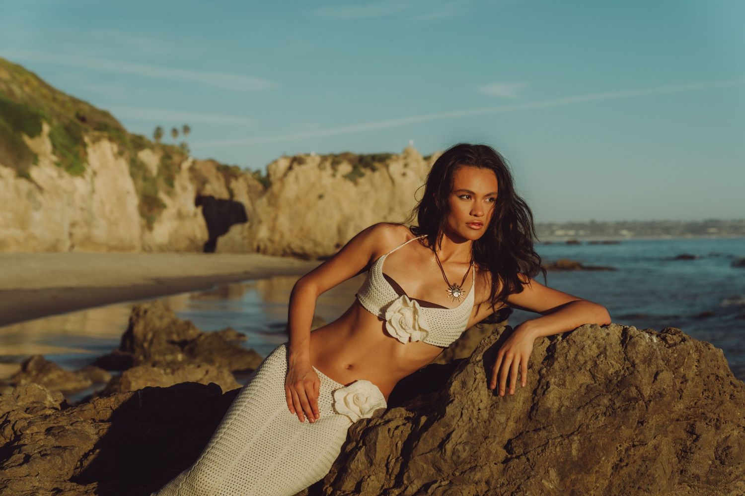 A series of coastal landscape photos featuring rocky cliffs and beaches at sunset with natural lighting.