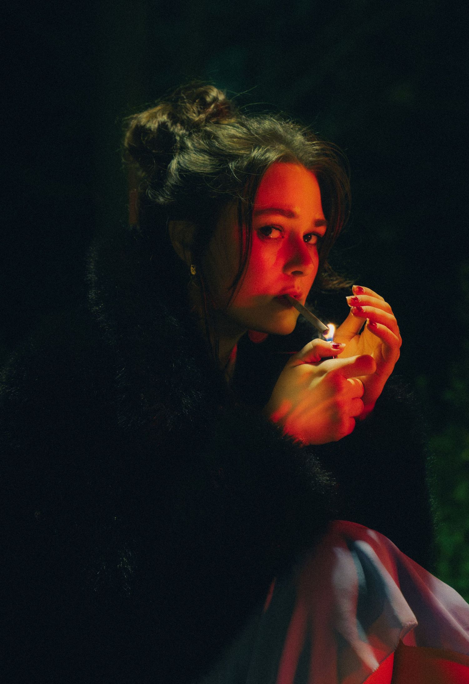 Dramatic portrait series lit with moody red lighting against dark shadows creating an atmospheric cinematic effect.