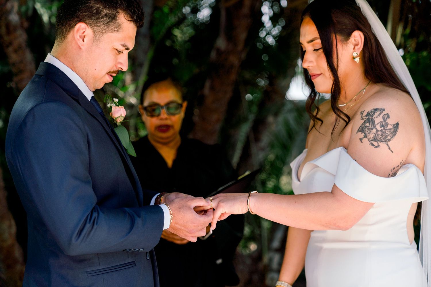 A series of candid dancing moments from a wedding celebration in an outdoor garden setting.