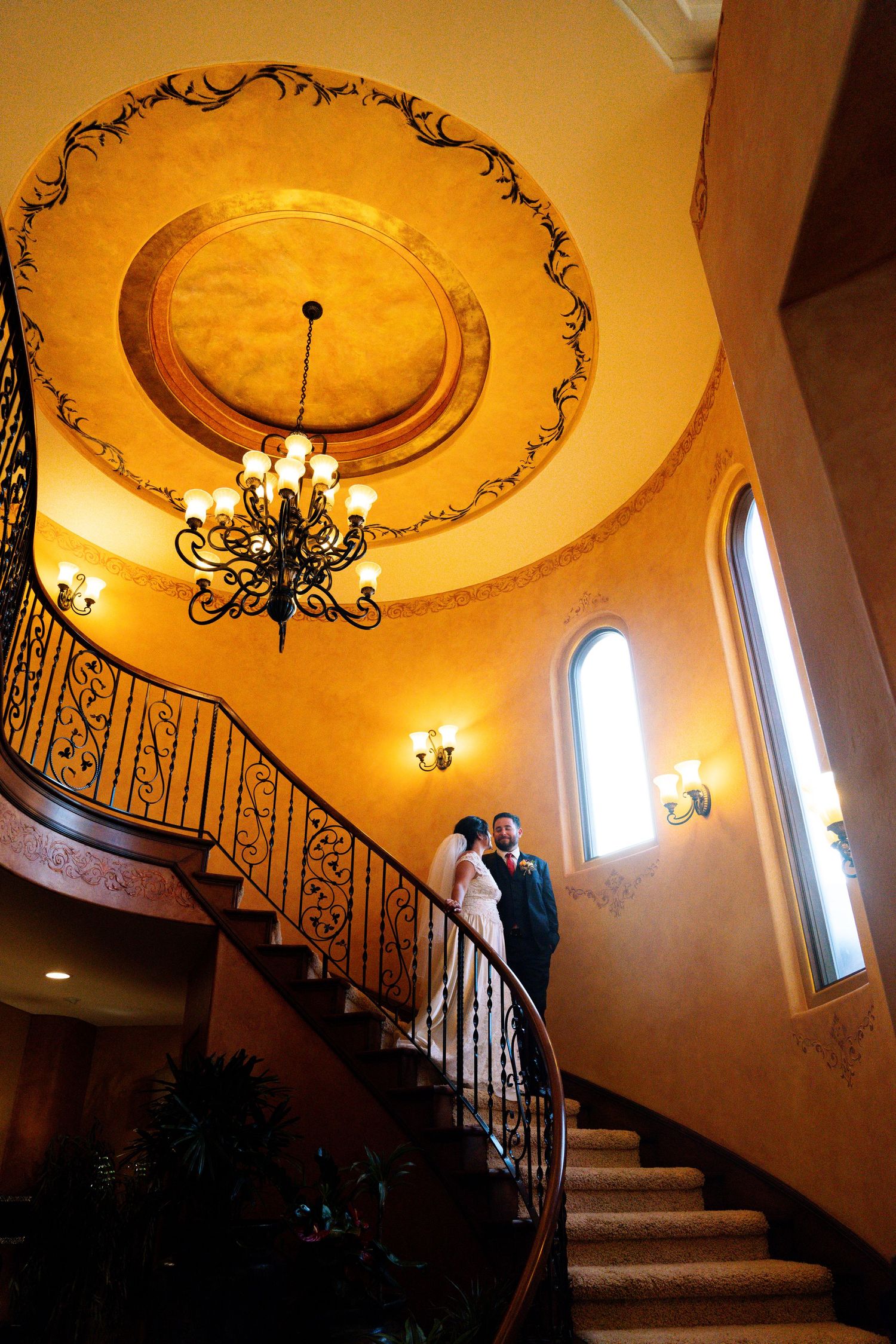 Multiple romantic interior shots showcasing elegant baroque ceilings with black chandeliers and spiral staircase in warm lighting.