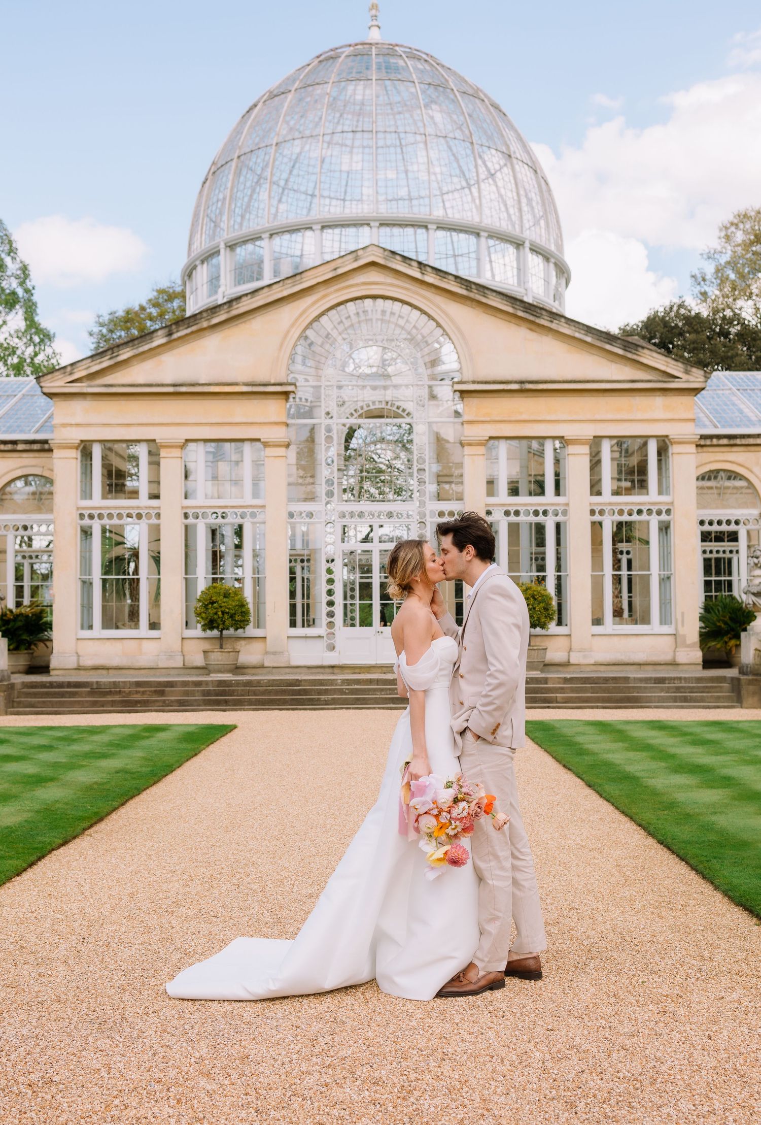 bride and groom standing outside Syon Park House and Garden