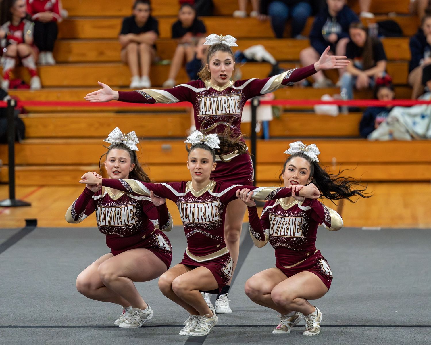 Fv3 Media Athlete Ambassador Abby Labonte - Cheerleader Captain for Alvirne High School cheering as a base at a NHIAA spirit competition
