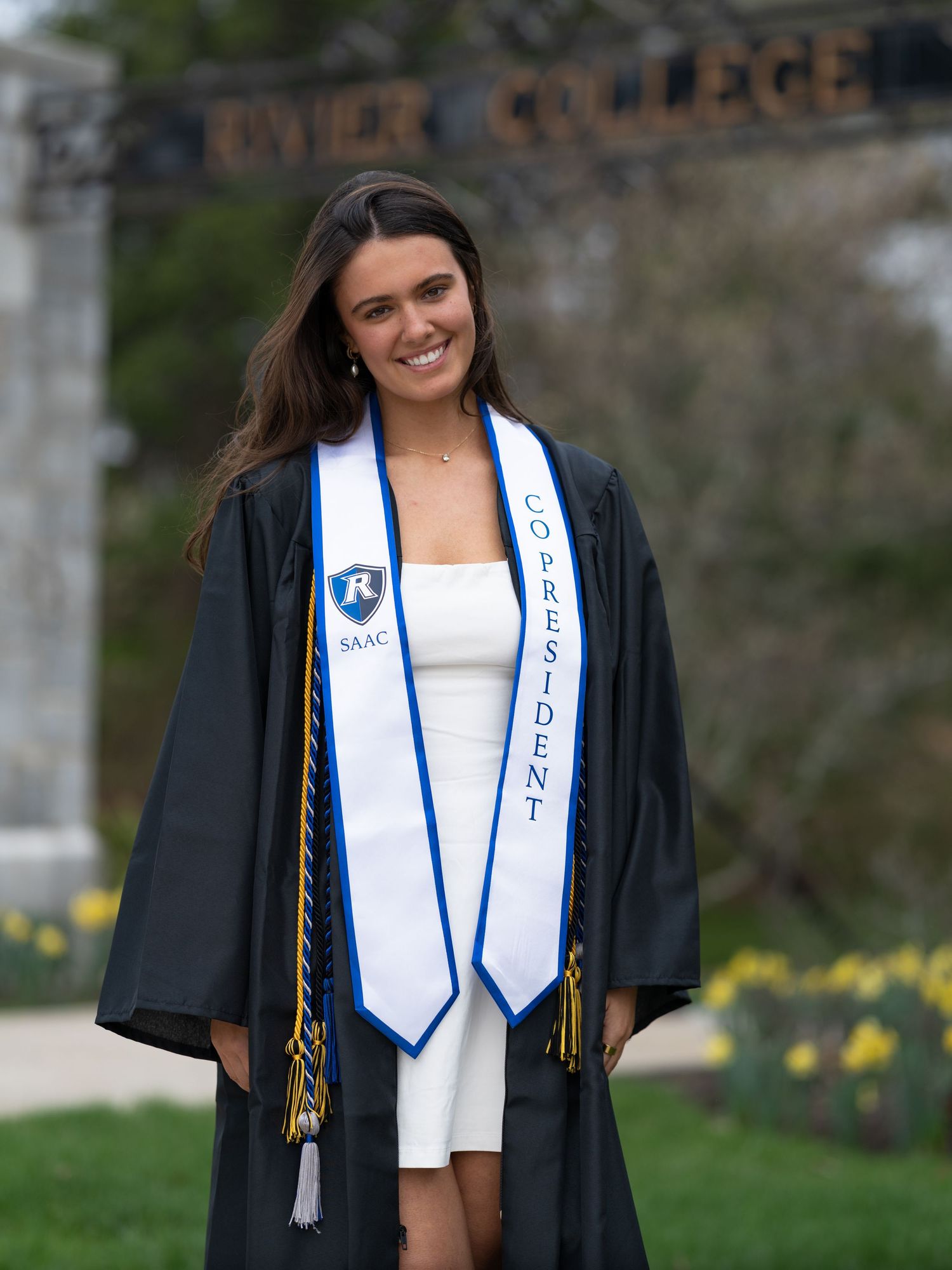 New Hampshire Rivier University Elementary Education graduate celebrates her degree with a senior photo session in New England.