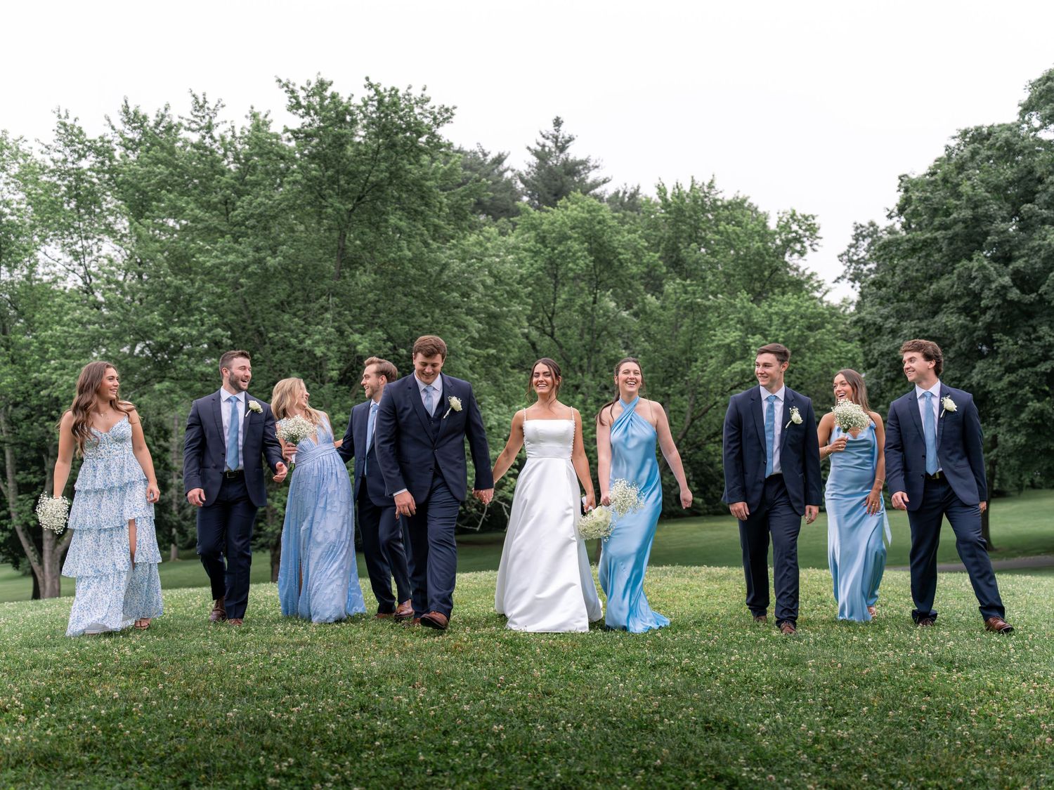 Photography of bride and groom sharing a moment with friends and family after an elegant New England church wedding ceremony New Hampshire.