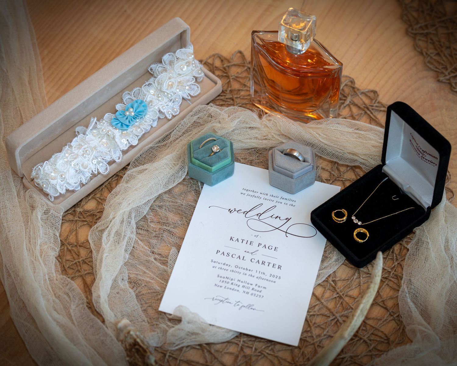 Photography of lay flat invitation before an elegant New England wedding ceremony celebration in New Hampshire while the bride preps hair