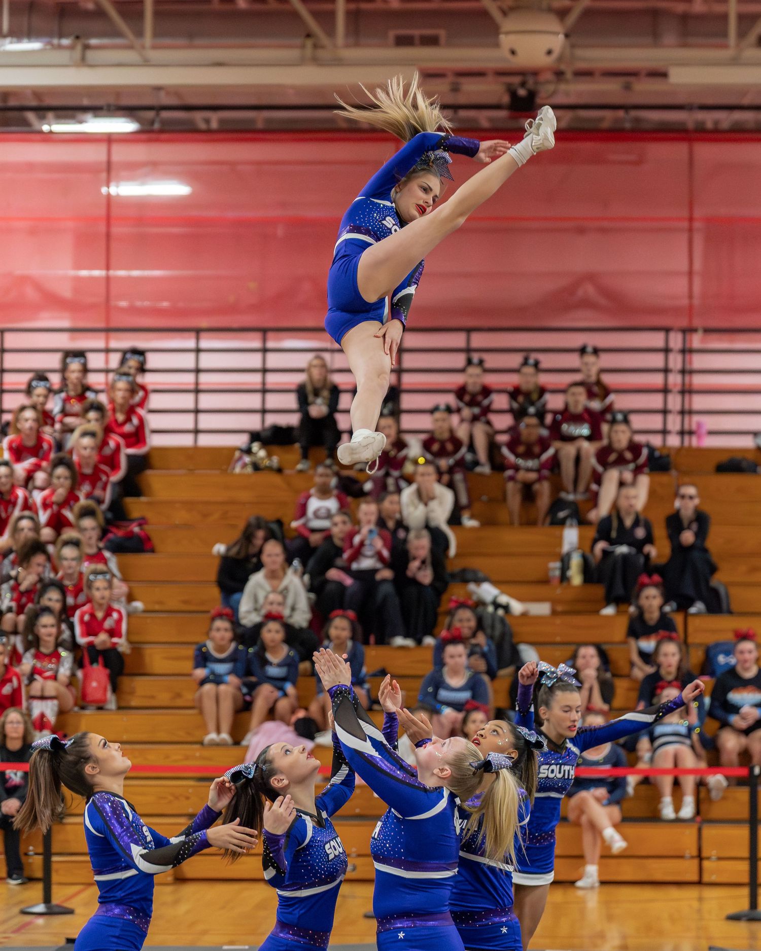 Fv3 Media Athlete Ambassador Destinee Garcia - Cheerleader for Nashua High School South cheering as a flyer at a NHIAA spirit competition