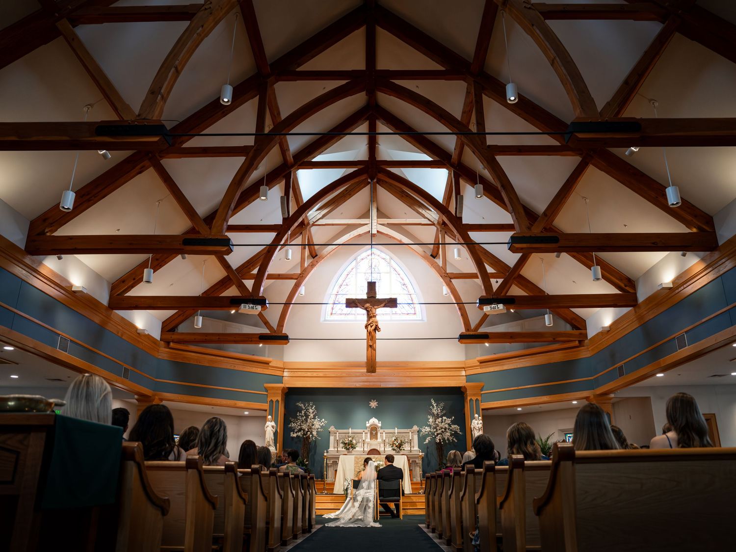 Photography of bride and groom sharing a moment with friends and family after an elegant New England church wedding ceremony New Hampshire.