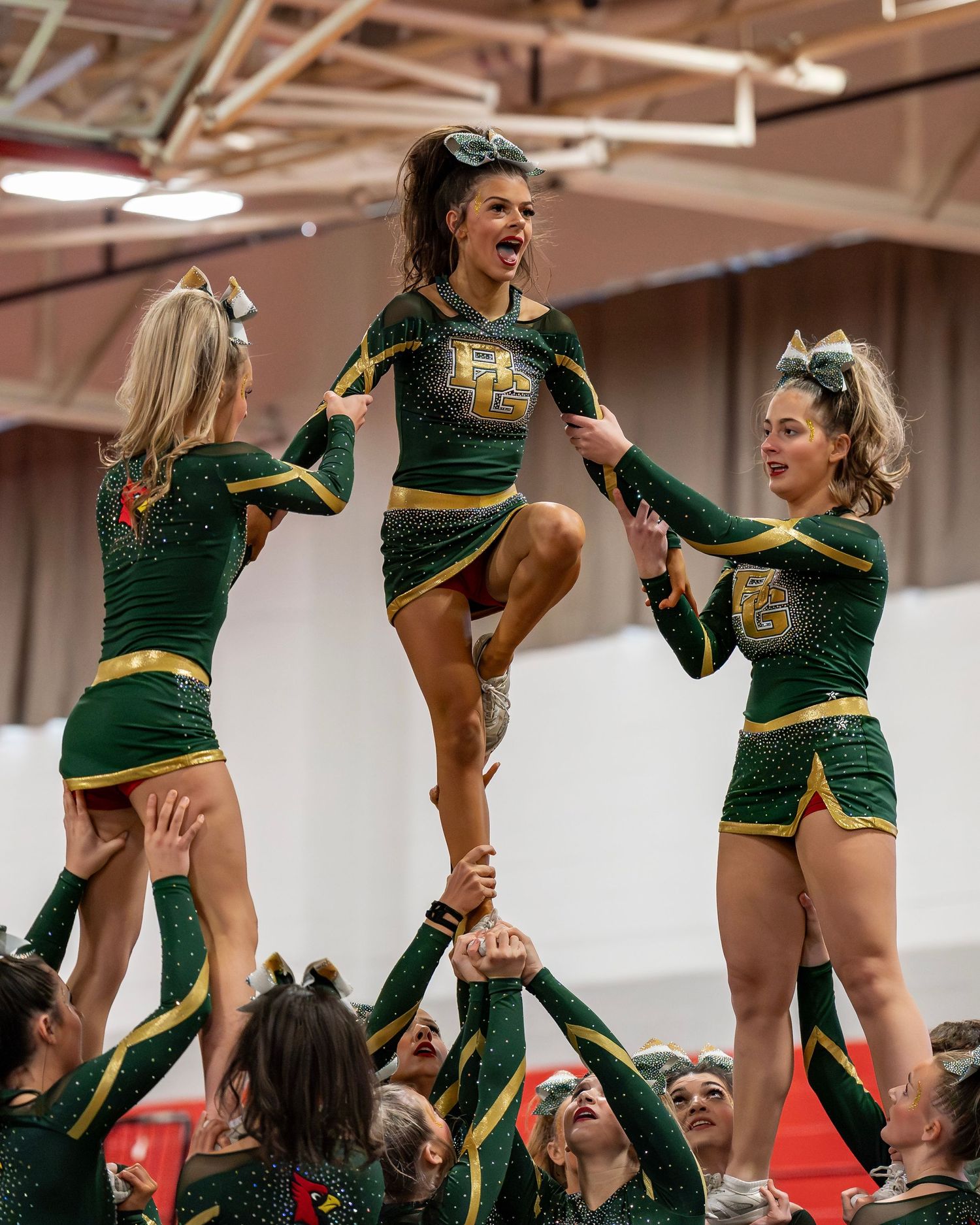 Bishop Guertin girls cheerleading Fv3 Ambassador Norah Herrmann flyer cheer stunt at New Hampshire cheerleading competition