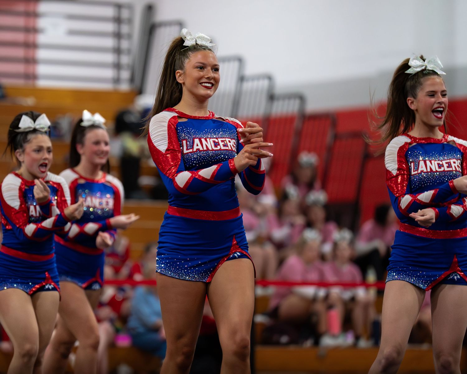 Fv3 Media Ambassador Sayde Thompson - Cheerleader Captain for Londonderry High School cheering as a base at a NHIAA spirit competition