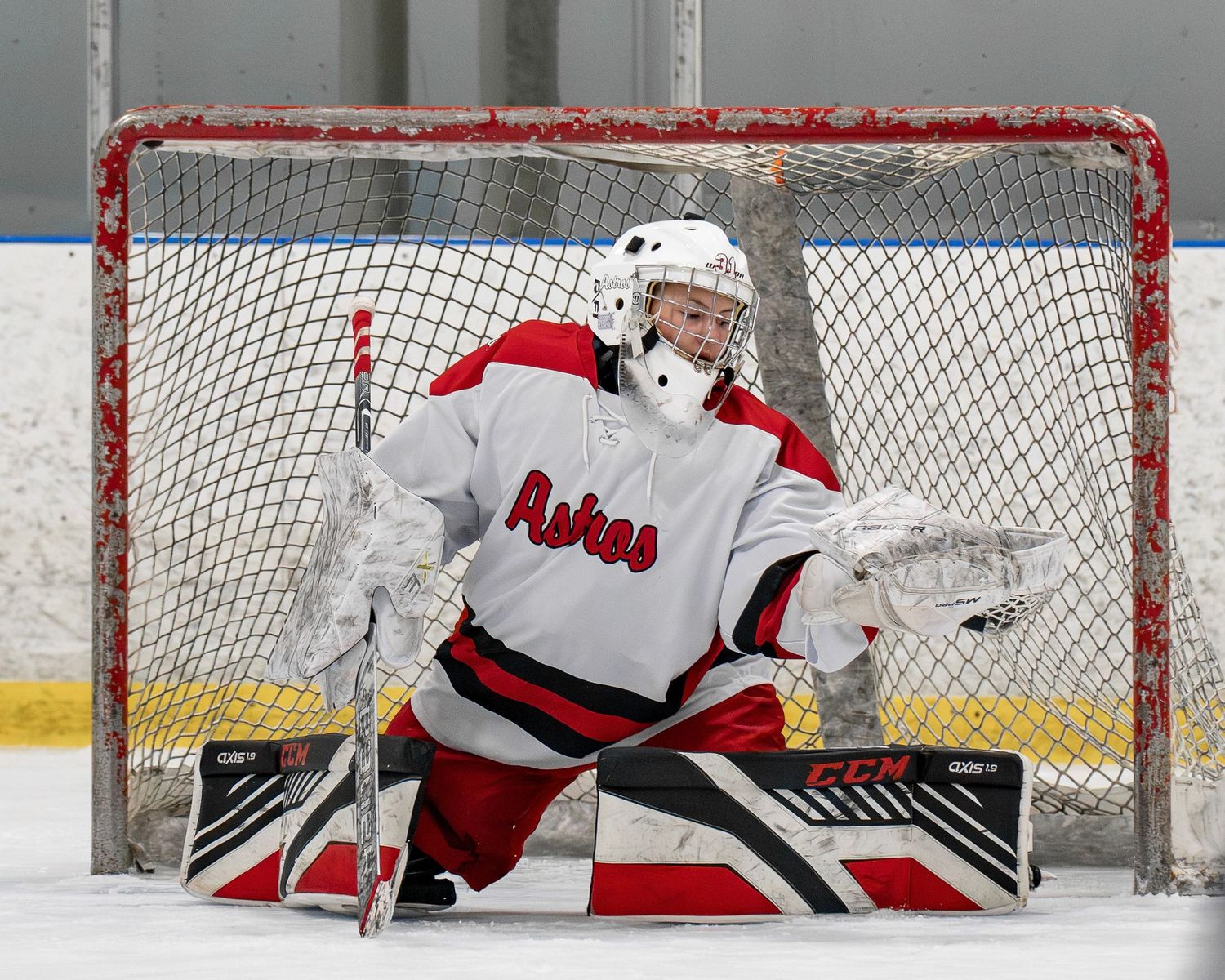 Fv3 sports photo of Pinkerton Academy Astros girls hockey goaltender Devyn Lyon makes the save during an NHIAA regular season hockey game