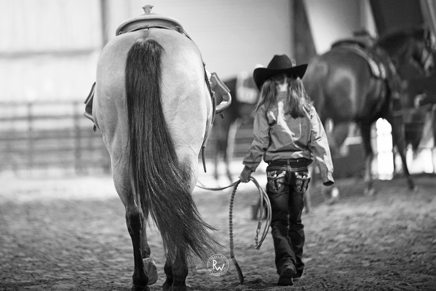 cowgirl leading her horse, longhorn arena and event center, greenville, Texas