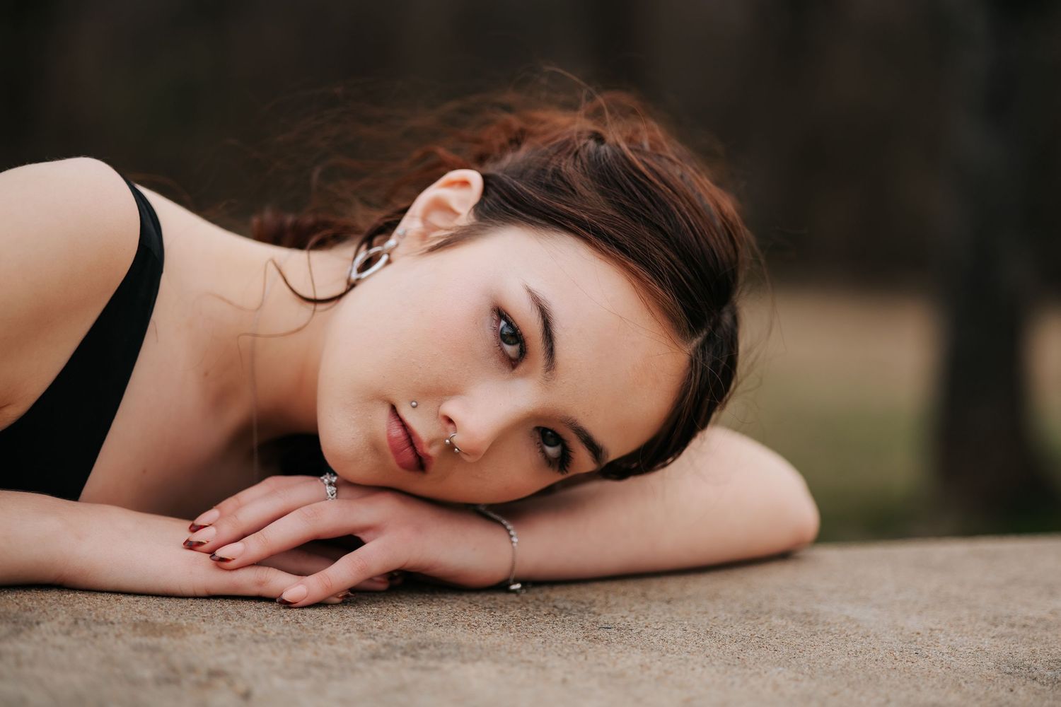 Dramatic portrait sequence showing elegant poses against a dark background.