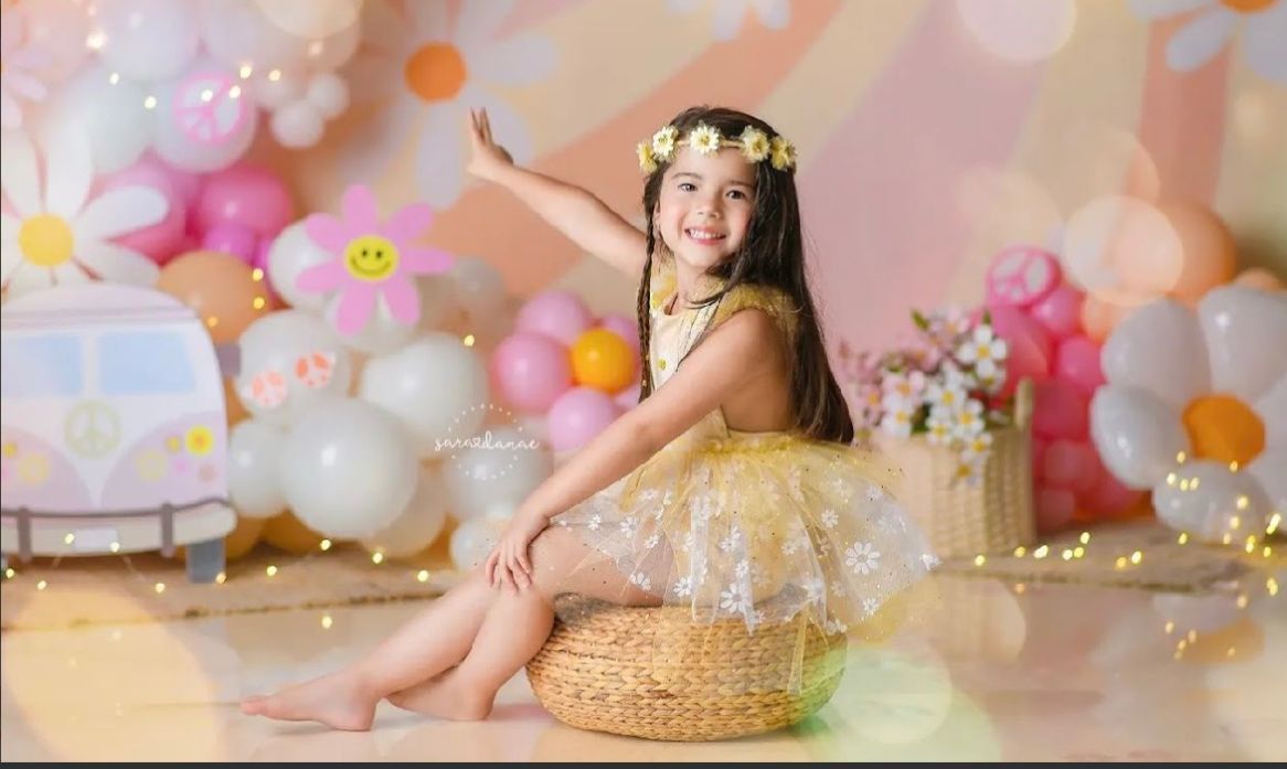 Dreamy pastel backdrop with soft pink and orange balloons creating a whimsical party setting.