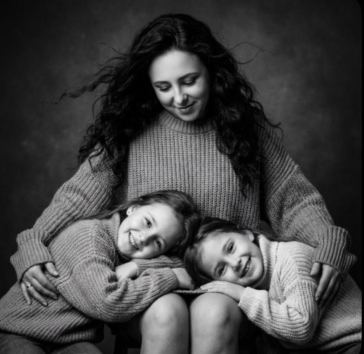 Black and white portrait series showing intimate moments of closeness and affection in cozy sweaters.