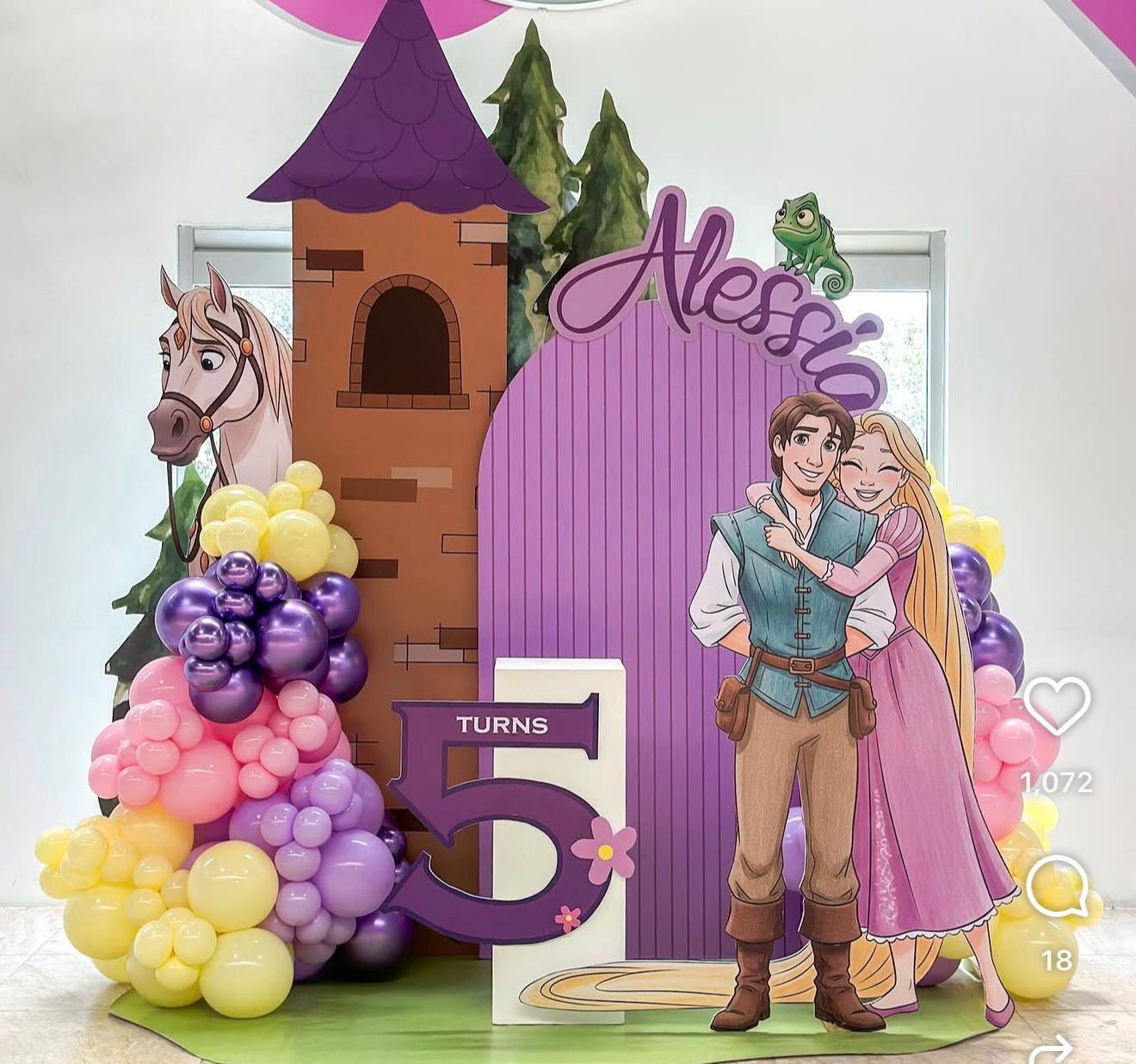 Tangled themed 5th birthday party backdrop with Rapunzel and Flynn Rider cutouts, balloon garland, and castle decorations.
