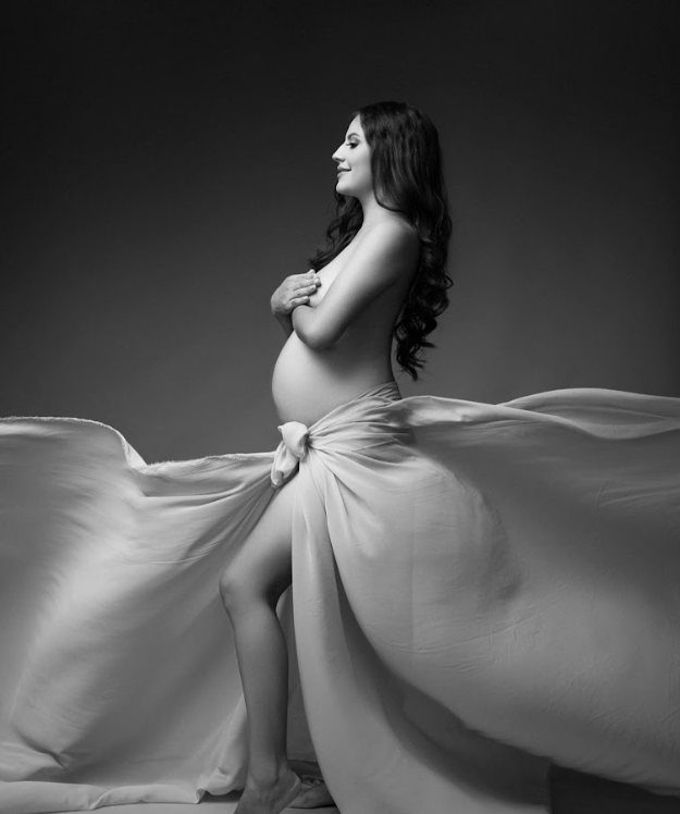 Artistic black and white photograph series showing flowing white fabric in graceful motion against dark background.