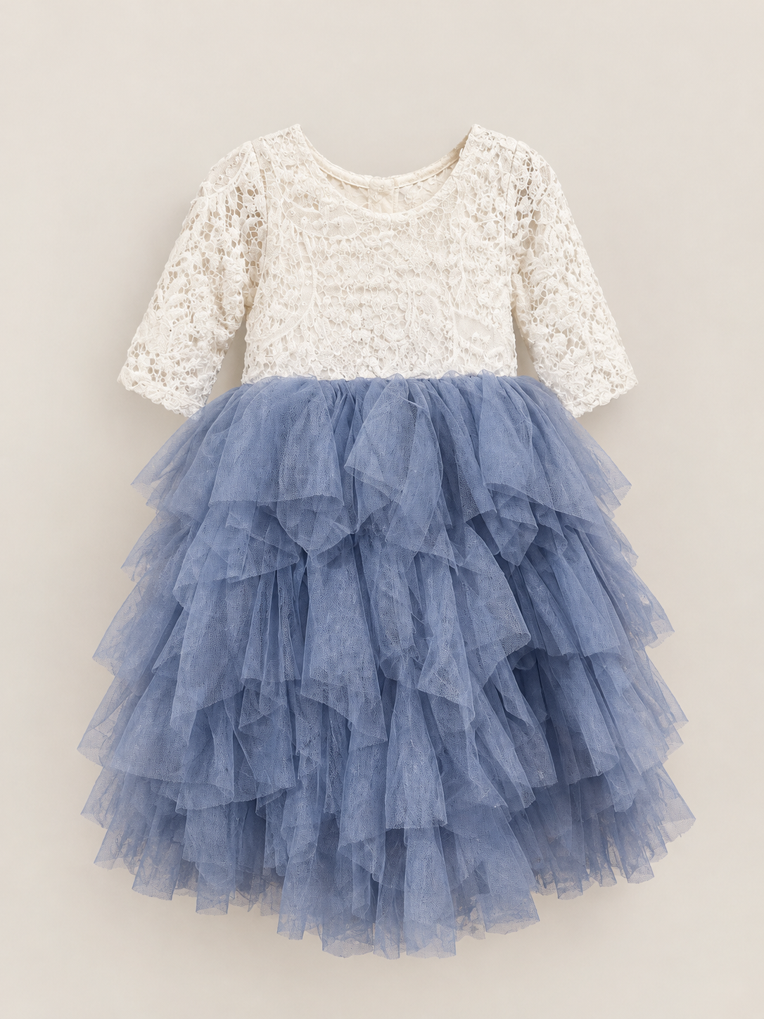 Girls' dress with cream lace bodice, three-quarter sleeves and a layered dusty blue tulle skirt, ideal for weddings and special occasions.