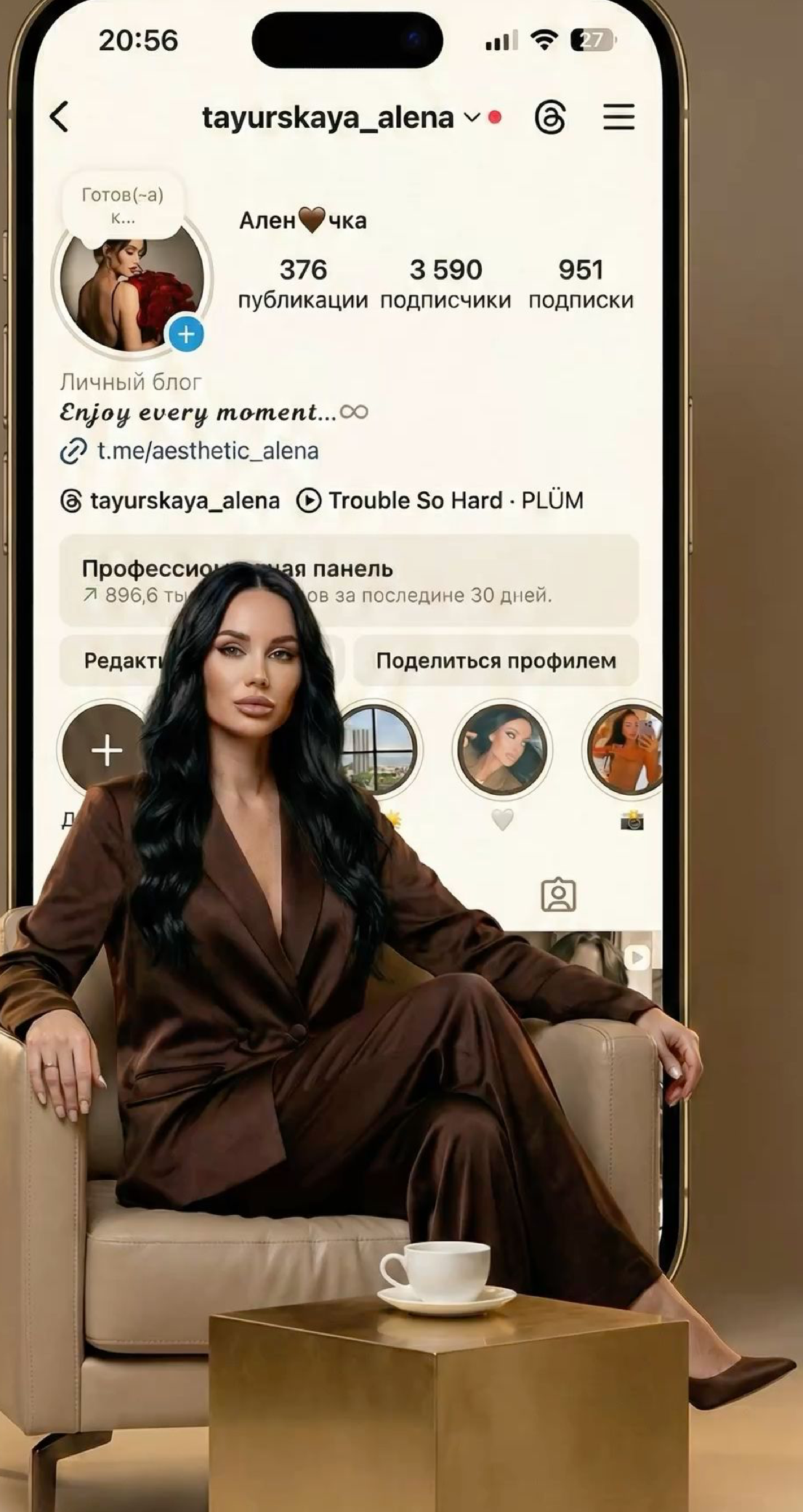 Woman in brown suit poses beside smartphone displaying Instagram profile of tayurskaya_alena with 3590 followers.