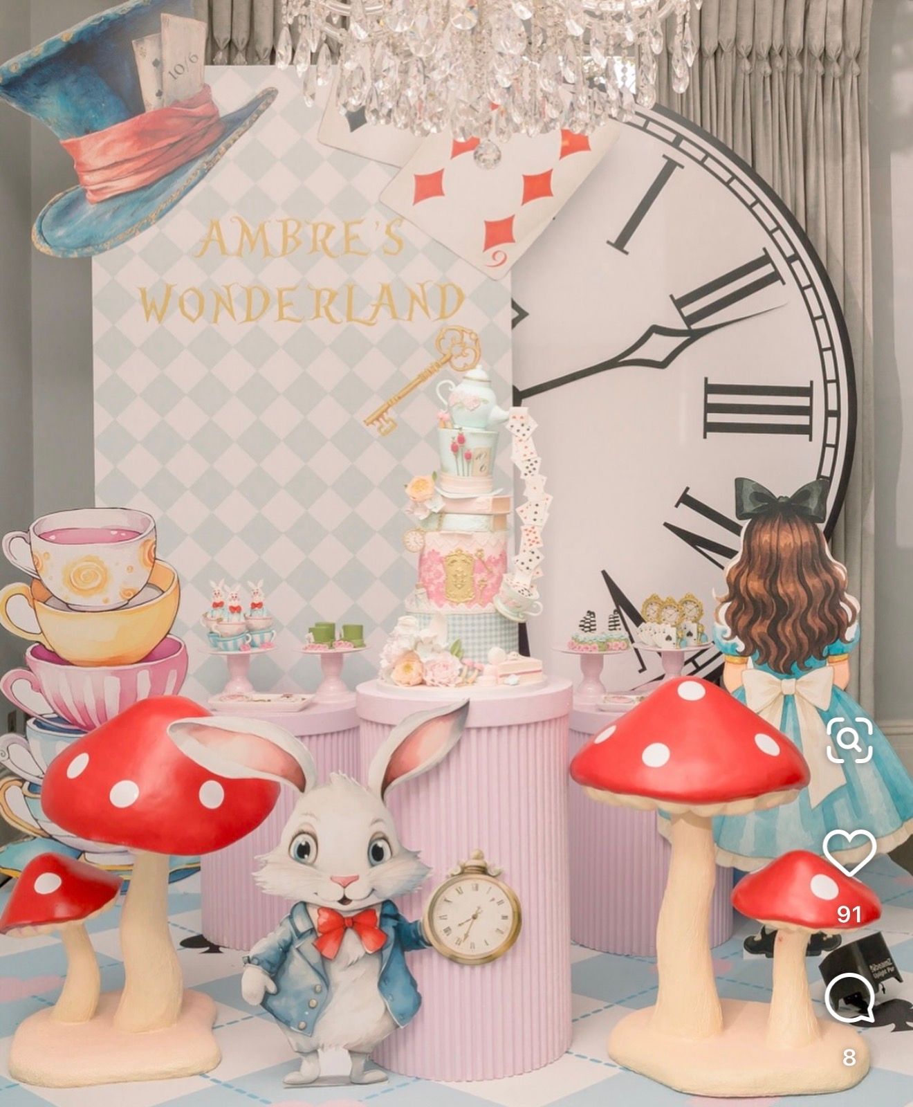 Alice in Wonderland themed party decor with mushrooms, White Rabbit, teacups, and a large clock backdrop.