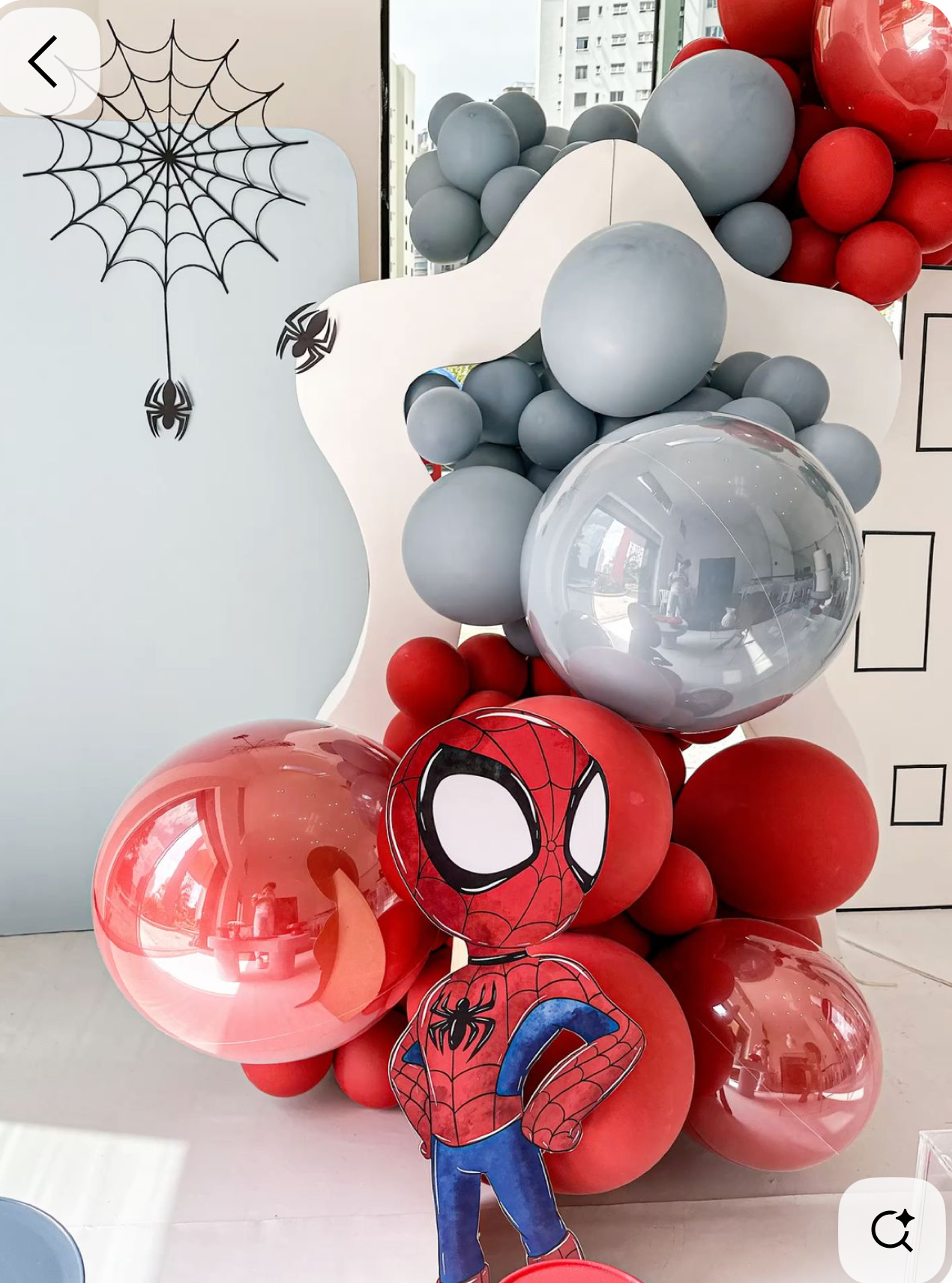 Spider-Man themed balloon arrangement with red, gray balloons and a Spider-Man character cutout, perfect for a superhero birthday party.