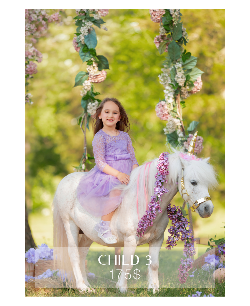 A young girl in a purple dress sits on a decorated white pony under a floral swing in a garden setting.
