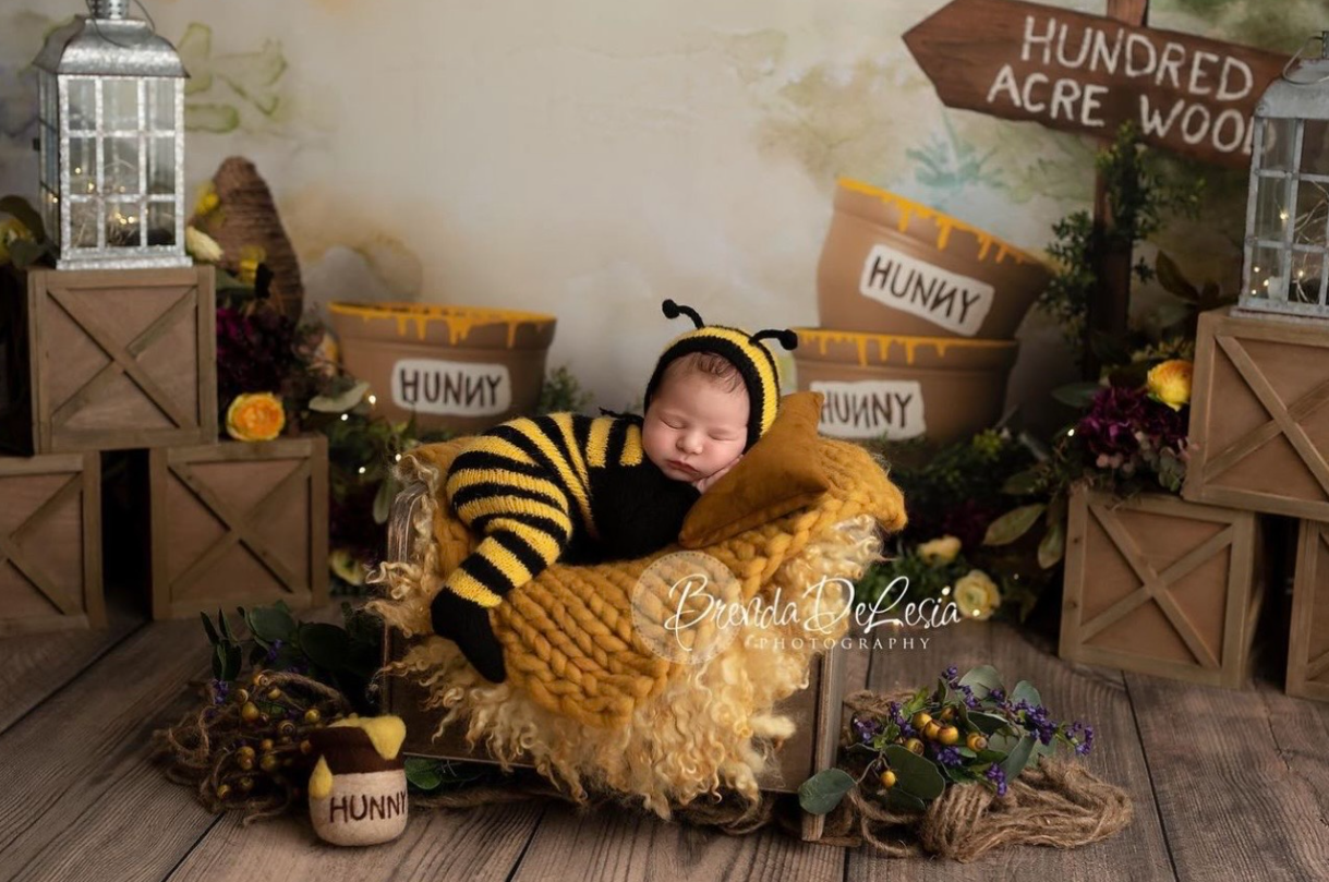 Rustic autumn decor display with wooden signs, hay bales, and seasonal decorations in a cozy indoor setting.