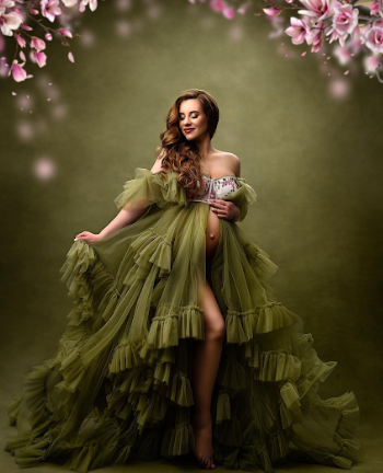Dramatic fashion photos featuring an olive green tulle gown against a moody floral backdrop.