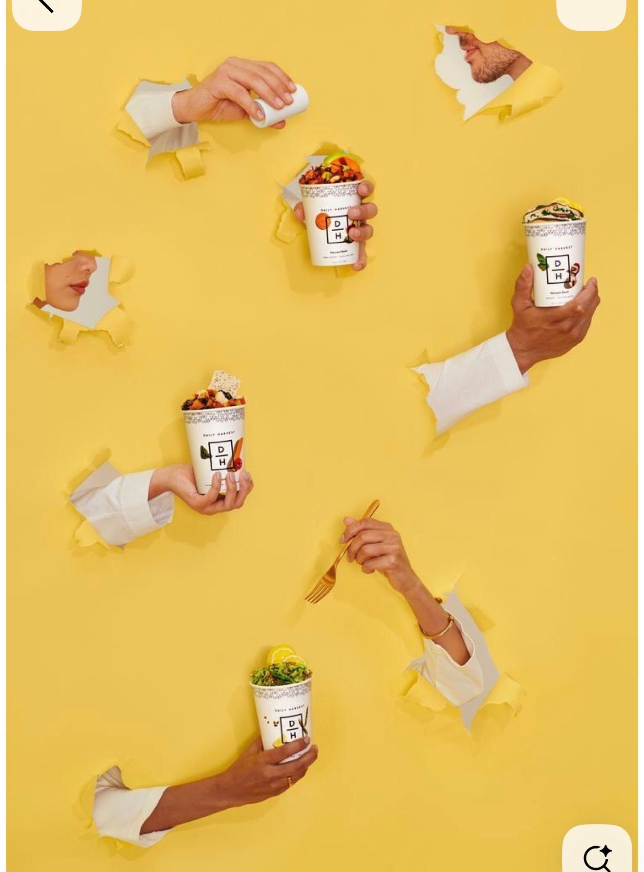 Multiple hands bursting through yellow paper holes holding branded cups filled with colorful toppings and treats.