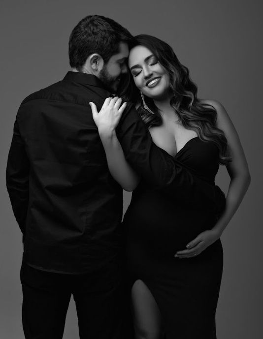 Black and white artistic boudoir photo series showing intimate couple poses against dark background.