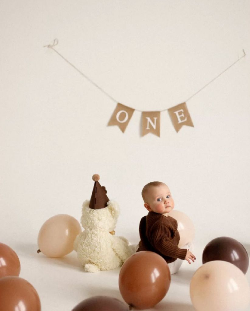 A creative photo series showing chocolate eggs with small toys emerging from broken shells against a white background.