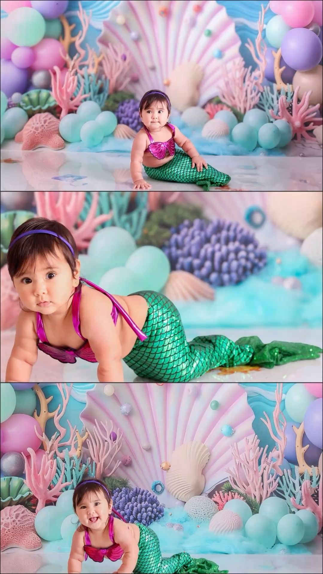 Baby girl in mermaid costume poses in colorful underwater-themed photo shoot with pastel balloons and coral decorations.
