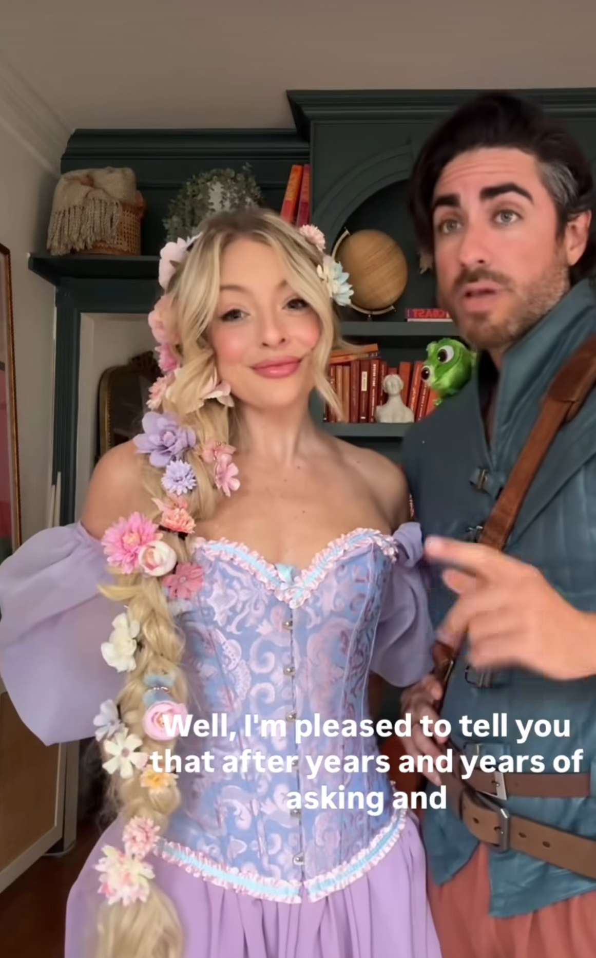 Two people cosplaying as Rapunzel and Flynn Rider from Tangled, with text overlay about years of asking.