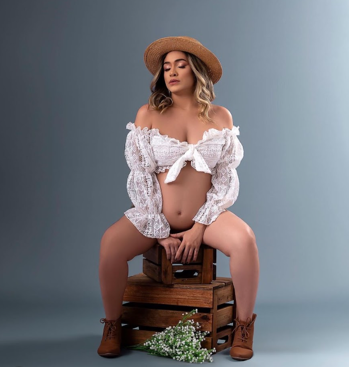 A sequence of artistic maternity photos showing a woman in a hat and white dress posing with a wooden bench and flowers.