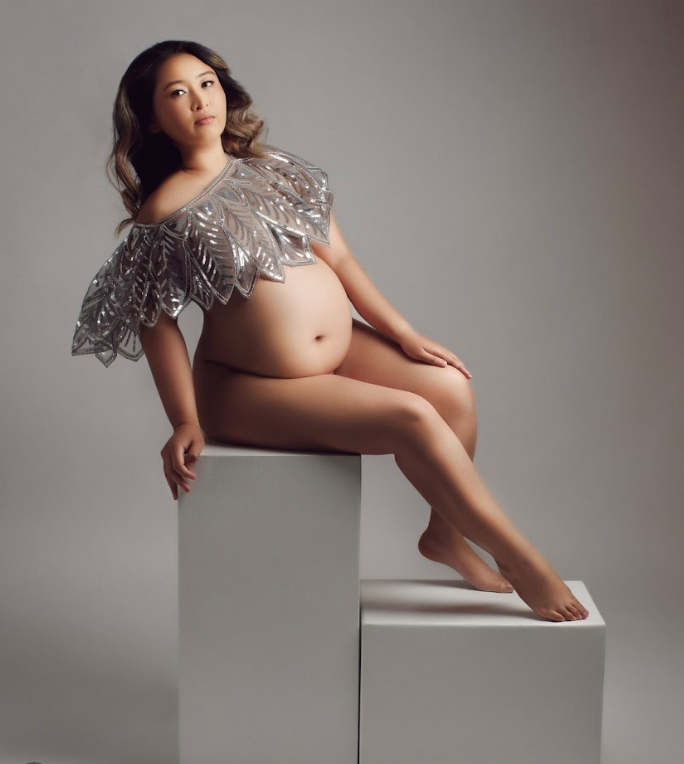 Artistic maternity photo series showing a pregnant figure in elegant poses against a minimalist grey backdrop.