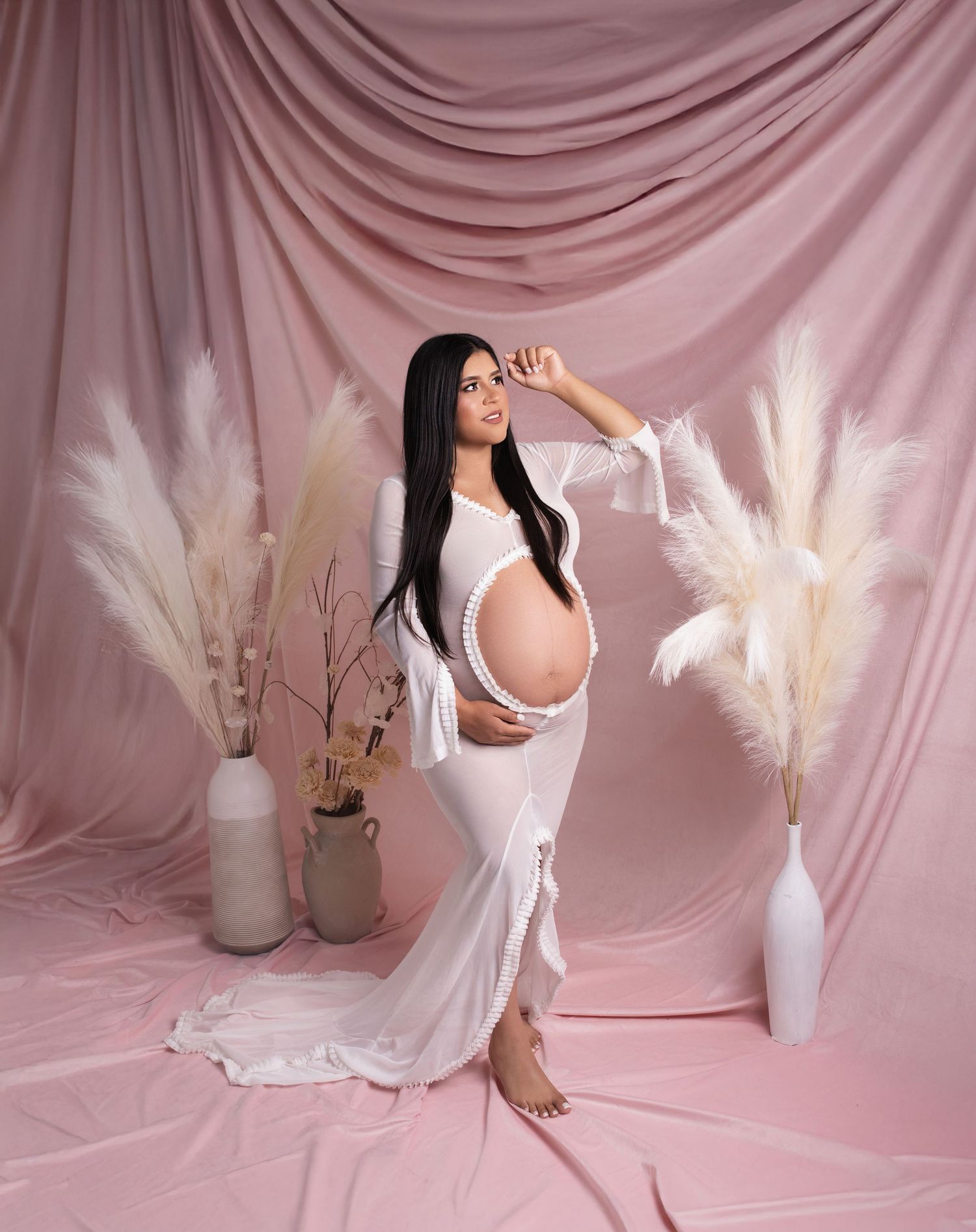 A dreamy pink and white aesthetic photo series featuring pampas grass arrangements and soft fabric draping in a minimalist setting.