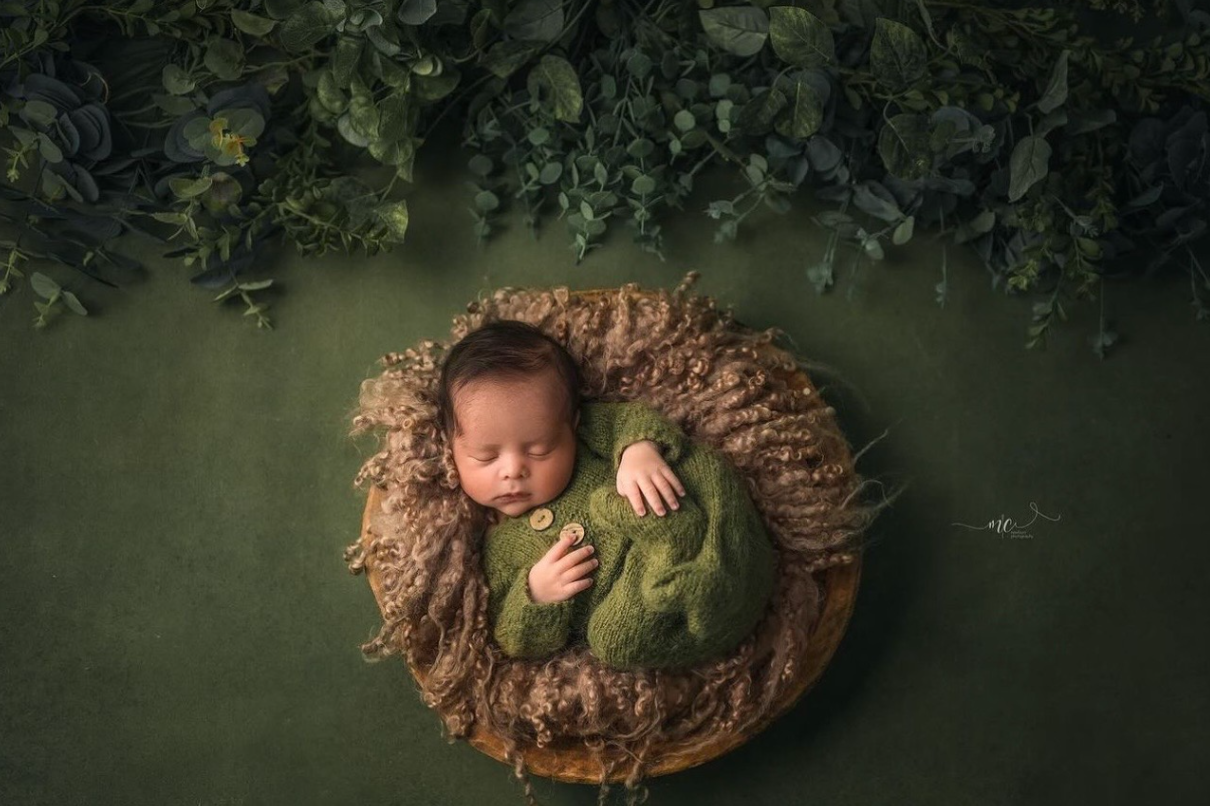A collection of newborn photography portraits showing a sleeping baby nestled in brown woven baskets against a dark backdrop.