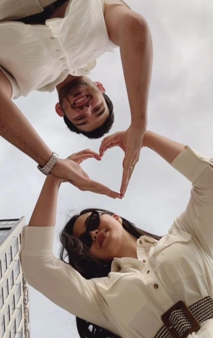 A sequence of selfie poses showing someone in a white shirt making hand gestures against a white background.